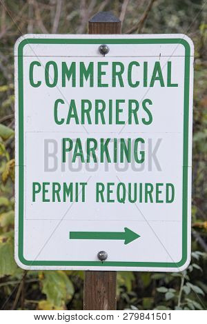 A Traffic Sign Stipulating Commercial Carriers Parking, Permit Required.