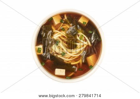 A Photo Of A Bowl Of Miso Soup With Tofu, Scallions, Noodles, And Wakame Seaweed, Shot From The Top,