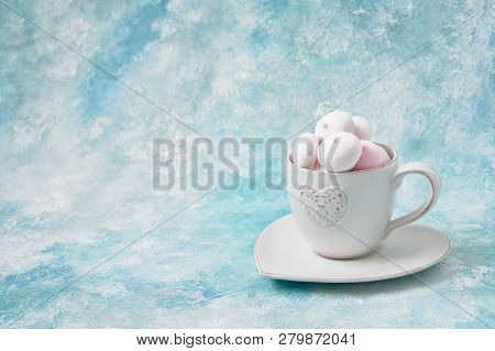 A Cup Of Home-made Meringues On Blue Background. French Dessert Meringue Prepared From Whipped With 