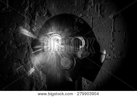 Art Picture Of A Military Gas Mask On A White Brick Wall With Shadows With Flash With The Inscriptio