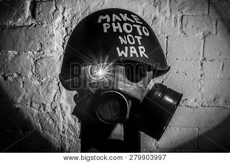 Art Picture Of A Military Gas Mask On A White Brick Wall With Shadows With Flash With The Inscriptio