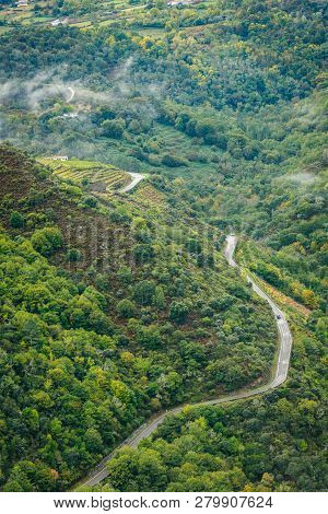 View Of Asphalt Road, Forest And Vineyards Along River Sil.