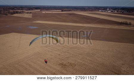 Paraglider Flies Over Fields. High Altitude. The Athlete Turns The Thermal Current. Rise Up. Weather