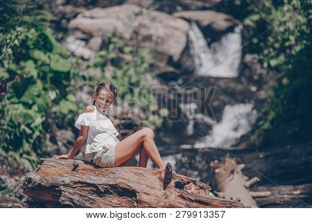 Little Girl Enjoying View Of Waterfall In Krasnay Poliana