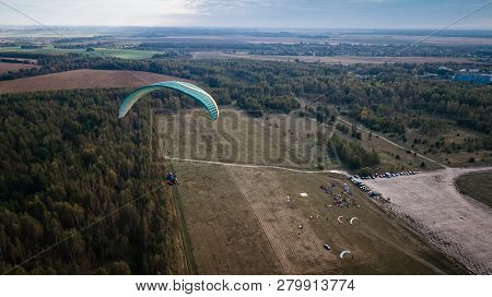 Paraglider Flies Over Fields. High Altitude. The Athlete Turns The Thermal Current. Rise Up. Weather