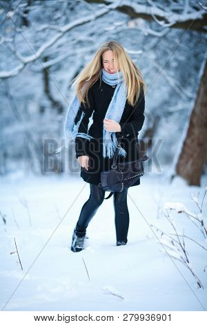 Beautiful Young Girl Smiling And Walking In The Street. Beautiful Snowy Cold Winter. Holiday Mood.