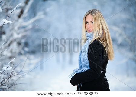 Beautiful Young Girl Smiling And Walking In The Street. Beautiful Snowy Cold Winter. Holiday Mood.