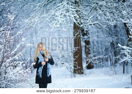 Beautiful Young Girl Smiling And Walking In The Street. Beautiful Snowy Cold Winter. Holiday Mood.