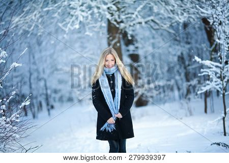 Beautiful Young Girl Smiling And Walking In The Street. Beautiful Snowy Cold Winter. Holiday Mood.