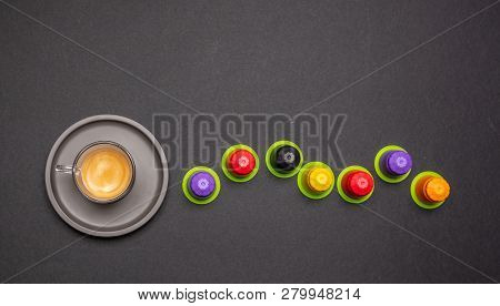 Espresso Coffee Cup And Capsules, Pods, On Black Color Background