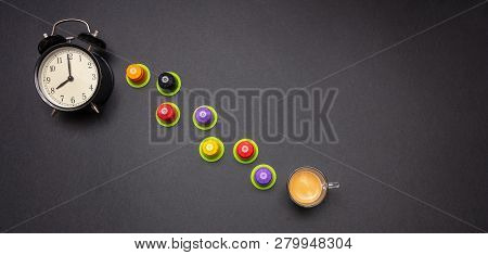 Alarm Clock And Espresso Capsules, Eco Friendly, Compostable On Black