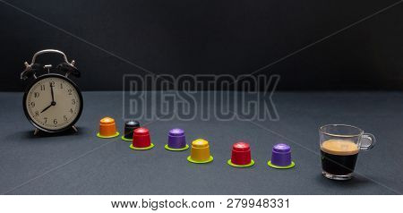 Alarm Clock And Espresso Capsules, Eco Friendly, Compostable On Black