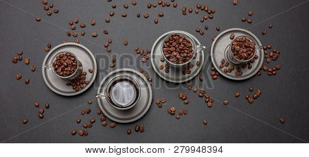Coffee Cups And Beans On Black Color Background, Top View