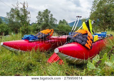 Water Trip On A Catamaran On A Dniester River. Red Catamarans Close-up.