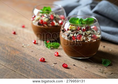 Chocolate Mousse Served With Pomegranate Seeds And Mint, Delicious Dessert