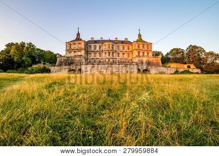 Pidhirtsi, Ukraine - July, 2017: Medieval Pidhirtsi Castle In Sunrise Summer Light, Pidhirtsi Villag