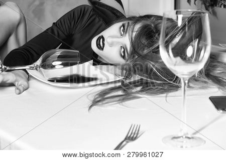 Sensual Elegant Sexy Glamour Young Drunk Woman With Beautiful Hair Lying On Table With Glass And Poo