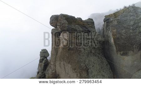 Aerial View On Mountains And Rocks In Fog. Shot. Foggy Background With Rocks