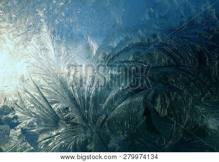 Bright Shades Of Blues And White Frost On Glass Window Pane Make Beautiful Pattern At Sunrise