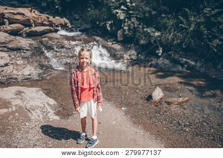 Little Girl Enjoying View Of Waterfall In Krasnay Poliana