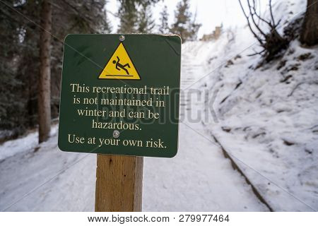 Sign Warning Hikers That The Trail Ahead Is Not Maintained During The Winter And Can Be Hazardous
