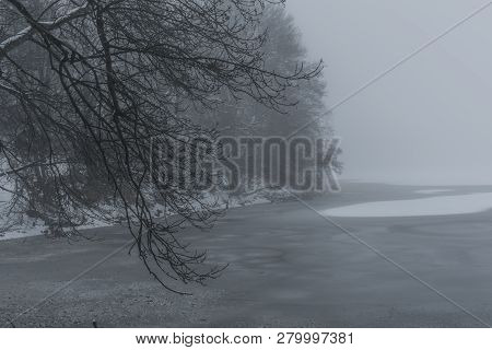 Frosty Pond With Mist And Snow In Dark White Winter Day Near Spa Town Kynzvart
