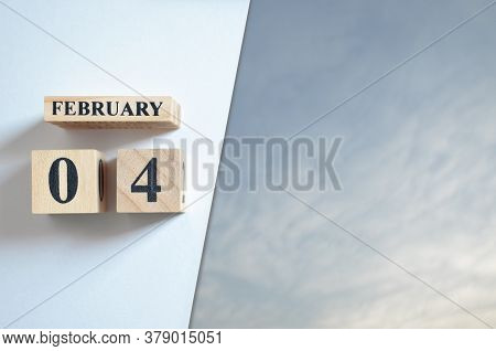 February 4, Blue Sky With Clound With Number Cube.