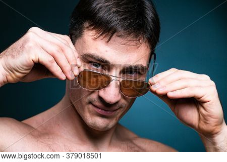 Gay Man Athlete Strong In Sunglasses Portrait