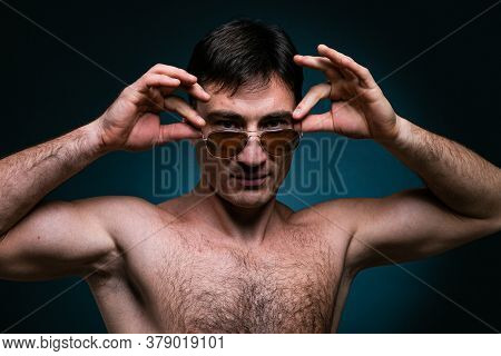 Gay Man Athlete Strong In Sunglasses Portrait