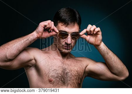 Gay Man Athlete Strong In Sunglasses Portrait