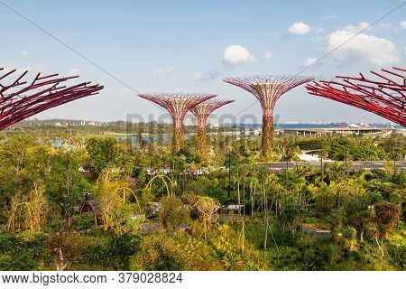 Singapore, Singapore - January 17, 2013. Decorative Towers In Shape Of Tree With Telpherage. Differe