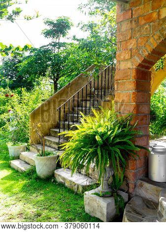 House Frontyard Cultured Veneer Stone Work Siding And Rod Iron Stairs