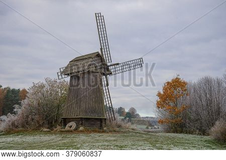 Old Wooden Mill Close-up On A Cloudy October Day. Mikhailovskoe, Puskinskie Gory. Russia