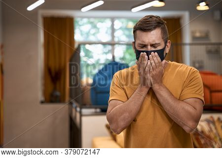 Business And Covid 19. Young Man, Male Office Worker Wearing Black Protective Mask Standing In The M