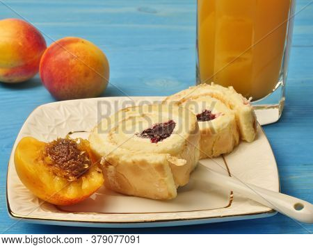 A Glass Of Apricot Juice, Beautiful Apricots, Buns On A Plate With Cherries, On A White Saucer, On A