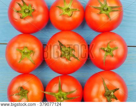 Red Tomatoes On A Blue Background, Close-up. Proper Nutrition. Dietary Products. Lifestyle.