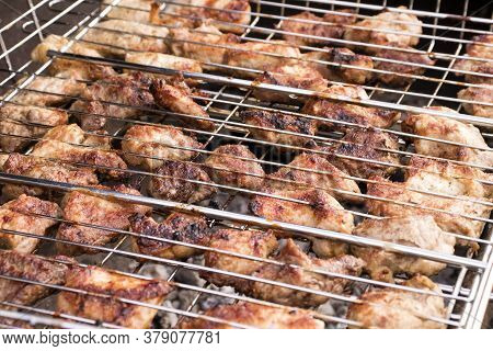 Fresh Juicy Cuts Of Meat On A Barbecue Grill, Selective Focus. The Concept Of Cooking Healthy Food O