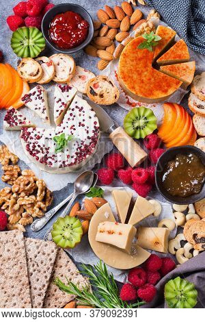 Plate Served With Assortment Of Organic Non-dairy, Raw Cheese From Cashew Nuts With Snacks, Fruits A