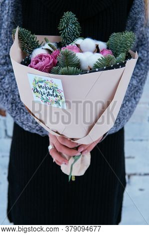 Bouquet Of Flowers And Fir Branches And Cottonwood Boxes In Peach Package In The Hands Of Woman Flor