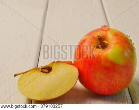 Two Red Ripe Apples On A White Wooden Background. Proper Nutrition. Lifestyle. Close- Up. Space For 