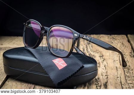 Russia. St. Petersburg / June 20, 2020: Ray Ban Glasses Frame On A Wooden Background