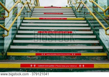 Prestatyn, Uk: Jun 6, 2020: Social Distancing Signage And Advice Is Displayed On The Edge Of Steps, 