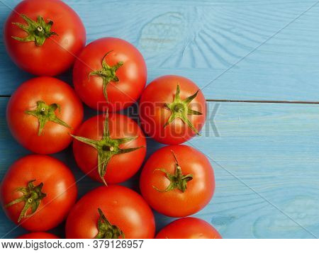Tomatoes Ripe Red Isolated On A Blue Background