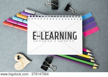 E-learning Text On A Notepad Lying On The Office Table.