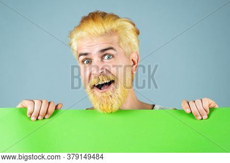 Happy Man Showing A Blank White Board. Advertising. Isolated Man Portrait. Happy Middle Age Man Pres
