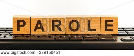 Parole Word Made With Building Blocks. A Row Of Wooden Cubes With A Word Written In Black Font Is Lo