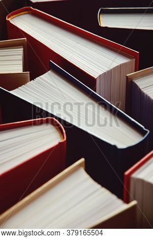 Many Hardcover Books Standing As Background, Vertical Photograph