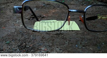 Future Word Displaying On Paper Slip Behind The Specs Glass With Black Soil Background Business Lead