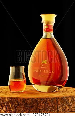 Tel Aviv, Israel - July 26, 2020: Deau Cognac Privilege With A Glass On A Wooden Stand On A Black Ba