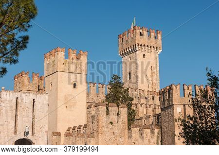 Rocca Scaligera Castle In Sirmione Town On The Garda Lake, Brescia, Italy. High Quality Photo